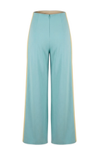 Light blue pants with yellow trim on a white background