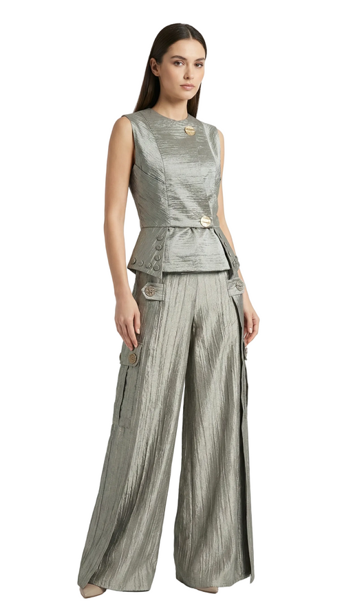 Woman wearing a gray sleeveless top and wide-leg pants on a white background