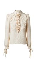 Vintage-style blouse with ruffled details on a gray background