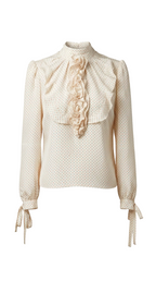 Vintage-style blouse with ruffled details on a gray background