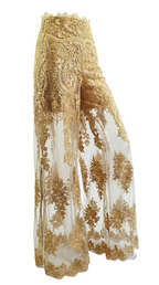 Gold embroidered pants on a white background